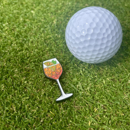 Alpharol golf ball marker on the green — magnetic hat clip, oven-cured enamel finish